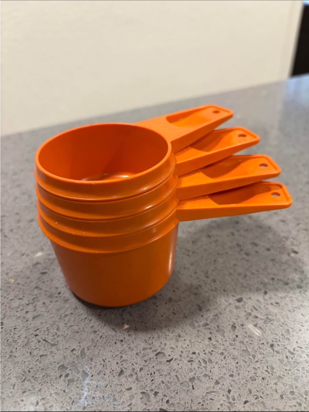 Orange Tupperware Measuring Cups